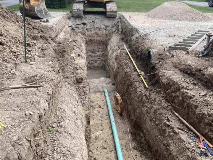 tying-water-and-sewer-into-the-main